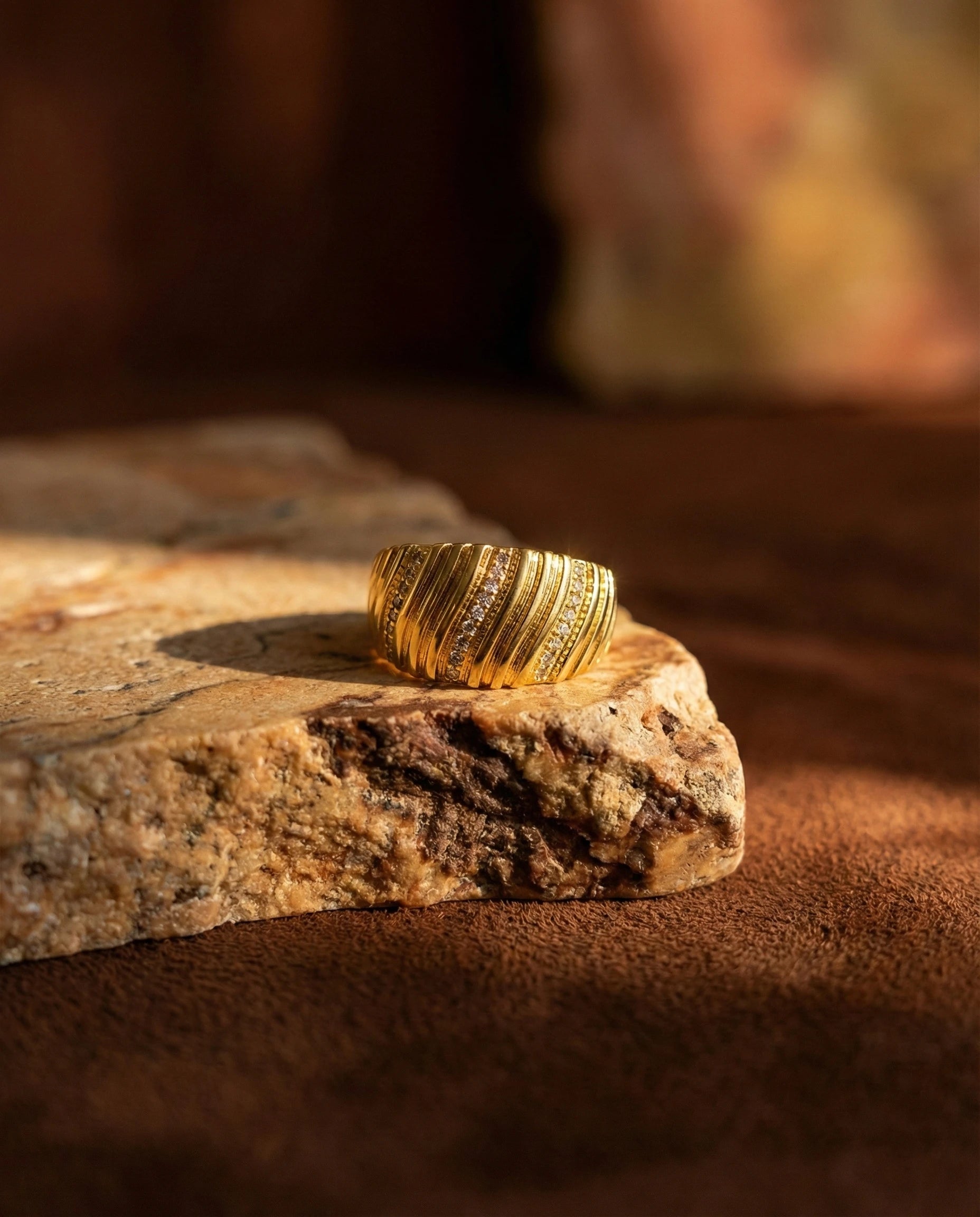 premium-quality-kenza-gold-crystal-band, durable-gold-plating-detail-europe, anniversary-gift-gold-bold-ring, refined-minimalist-power-aesthetic, sustainable-steel-jewelry-brand-europe