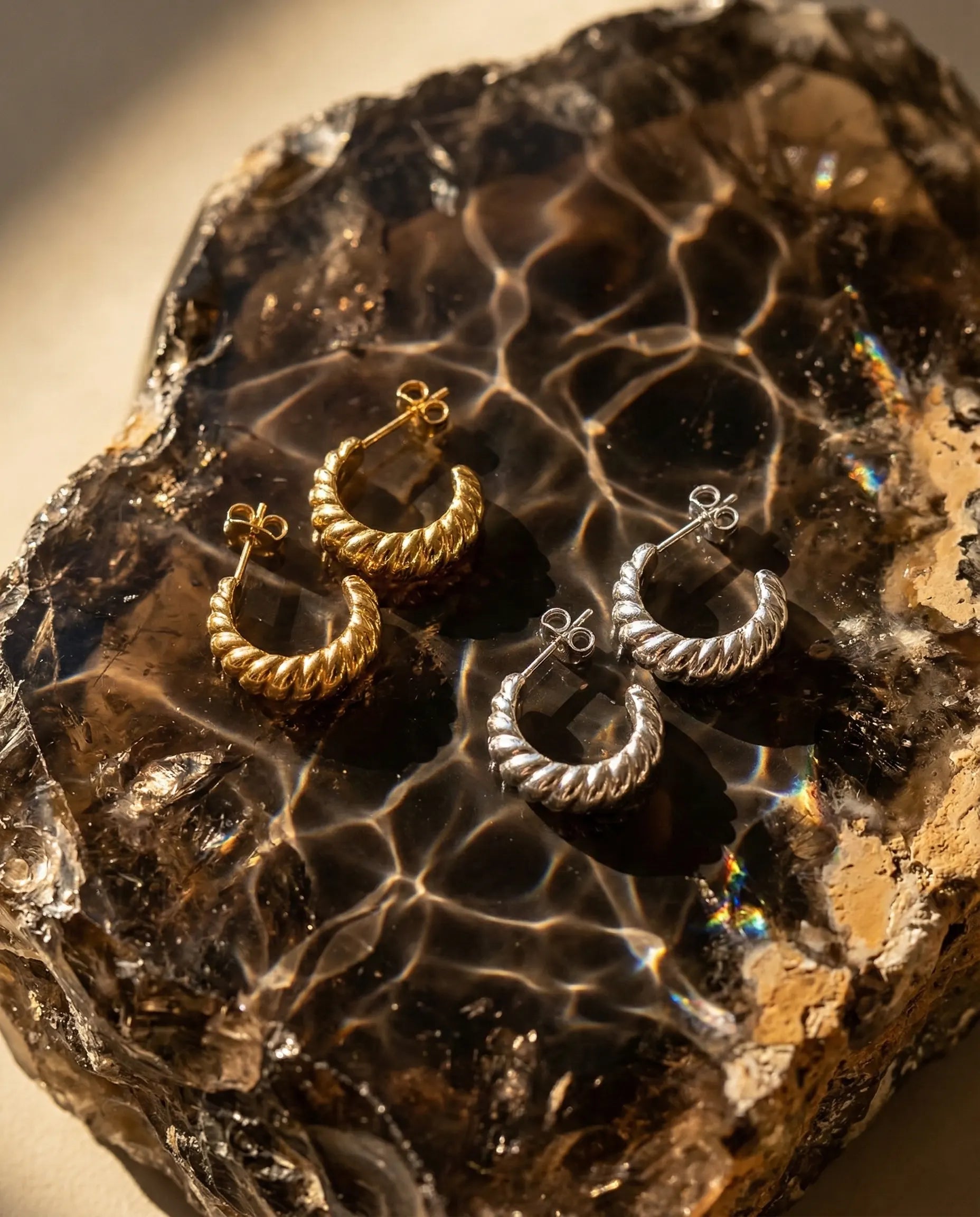 premium-quality-museful-gold-twisted-earrings, durable-gold-plating-detail-europe, anniversary-gift-gold-textured-hoops, refined-minimalist-shimmer-aesthetic, sustainable-steel-jewelry-brand-europe