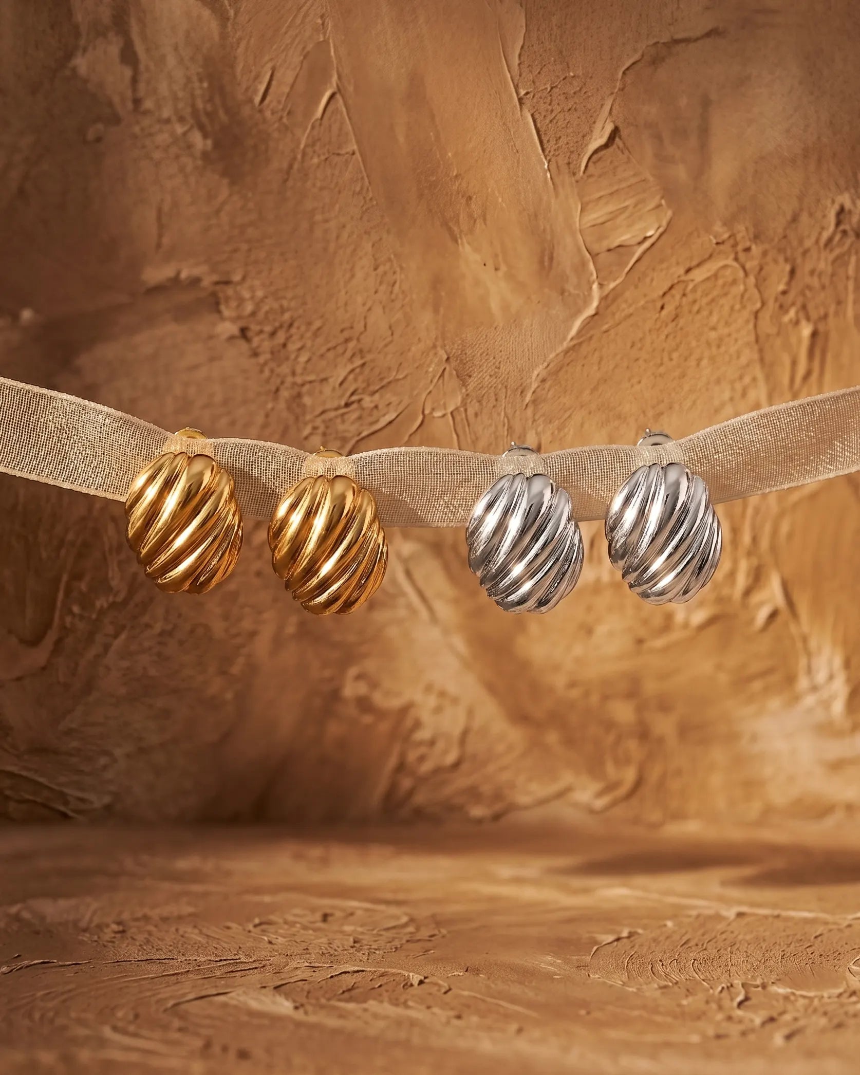 premium-quality-nia-textured-gold-steel-earrings, gold-pvd-detail-europe, anniversary-gift-modern-minimalist-jewelry, refined-minimalist-luxe-aesthetic, sustainable-steel-jewelry-brand-europe