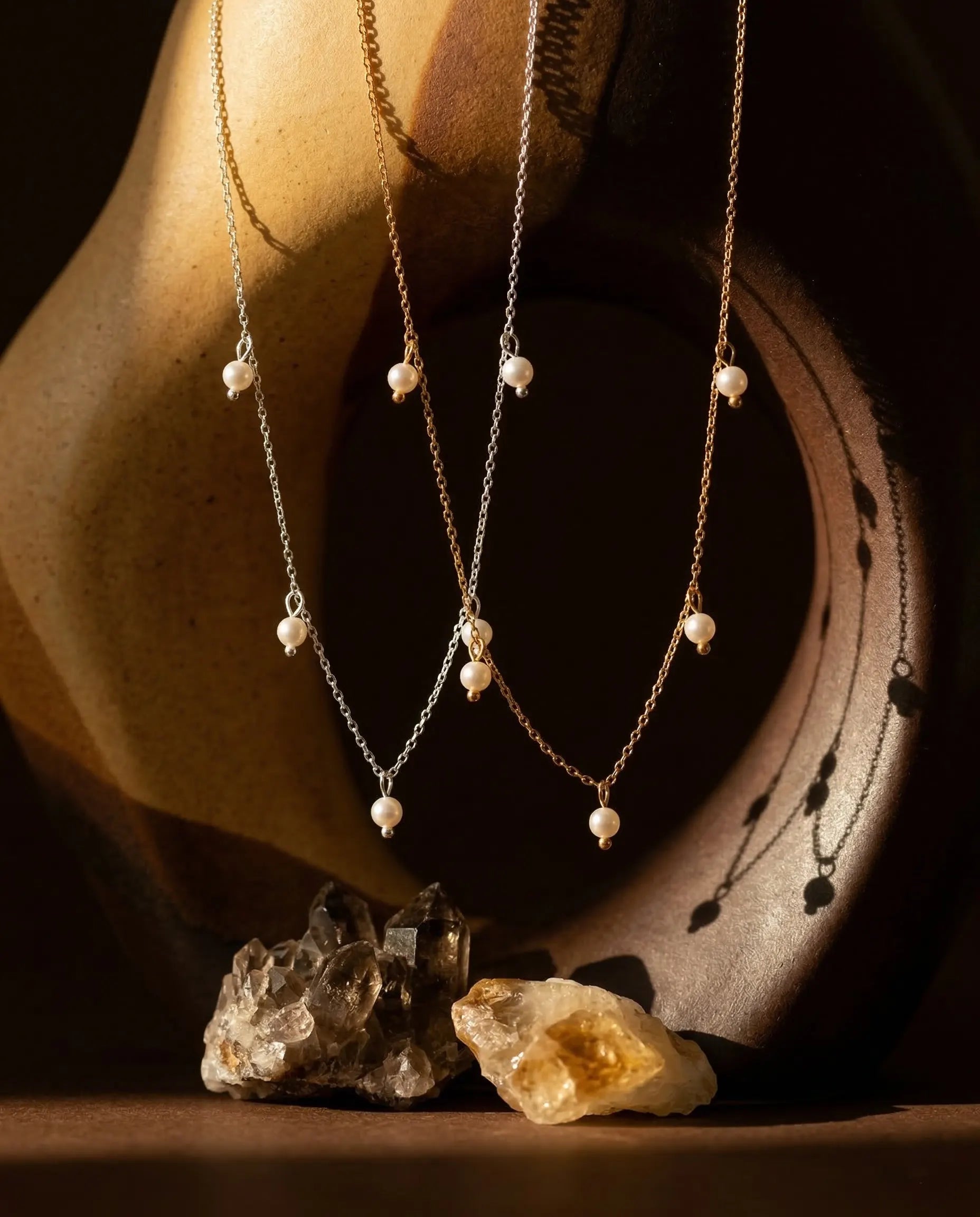 premium-quality-nora-pearl-drop-gold-silver-necklaces, durable-gold-plating-detail-europe, anniversary-gift-modern-pearl-pendant, refined-minimalist-luxe-aesthetic, sustainable-jewelry-brand-europe