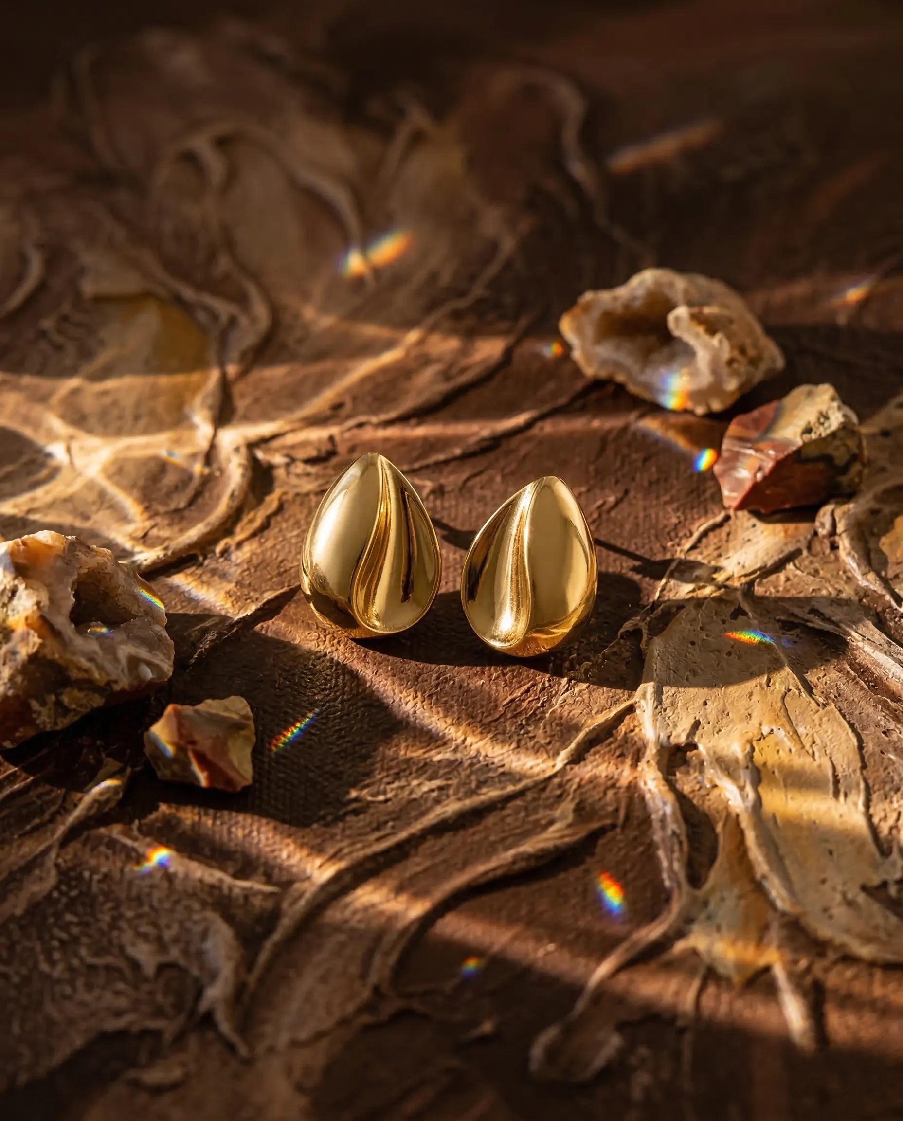 premium-quality-rhea-gold-organic-earrings, durable-gold-plating-detail-europe, anniversary-gift-gold-chunky-studs, refined-minimalist-luxe-aesthetic, sustainable-steel-jewelry-brand-europe