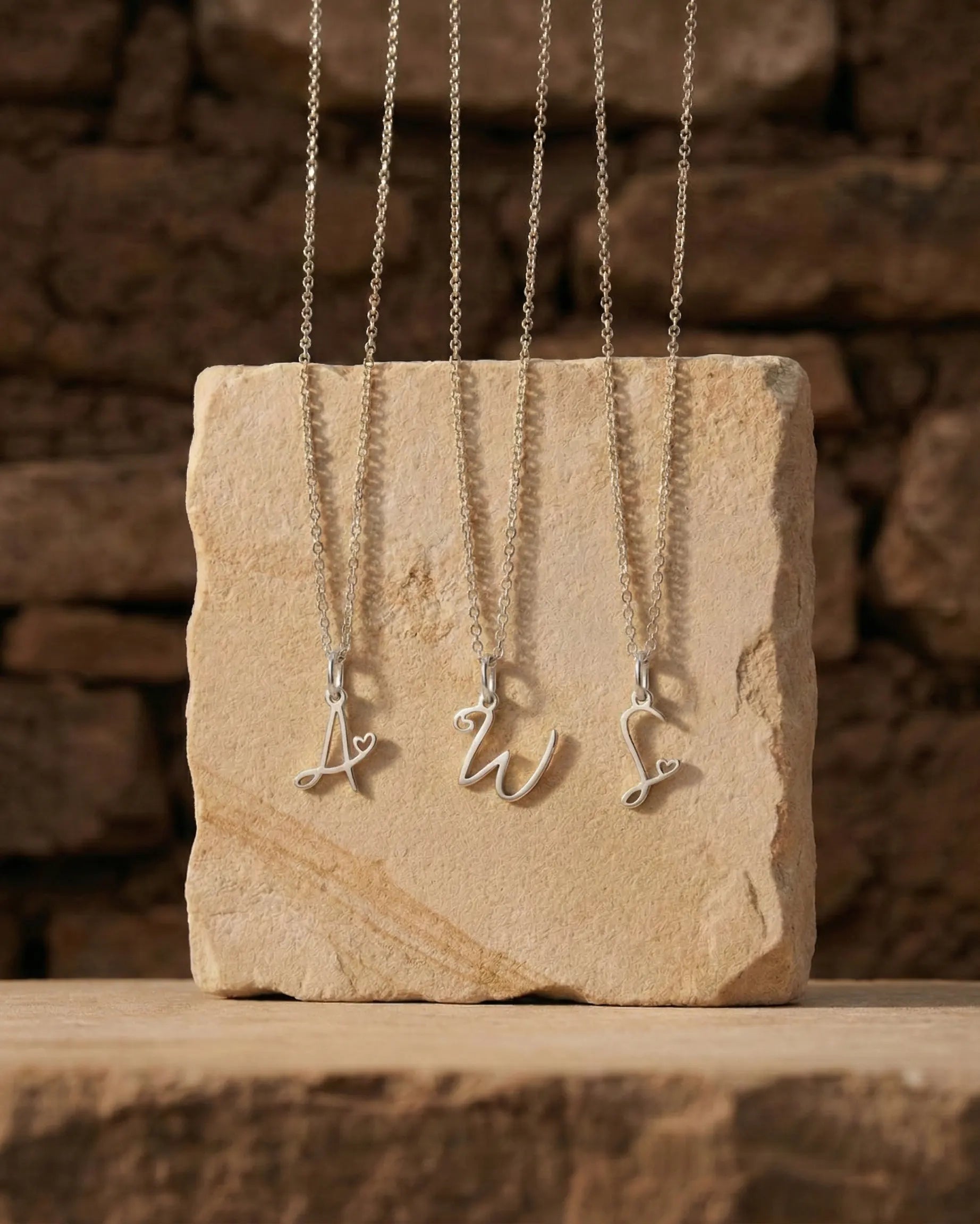 premium-quality-zahara-script-initial-necklace, durable-gold-plating-detail-europe, personalized-anniversary-gift-gold-letter, refined-minimalist-jewelry-aesthetic, sustainable-steel-jewelry-brand-europe