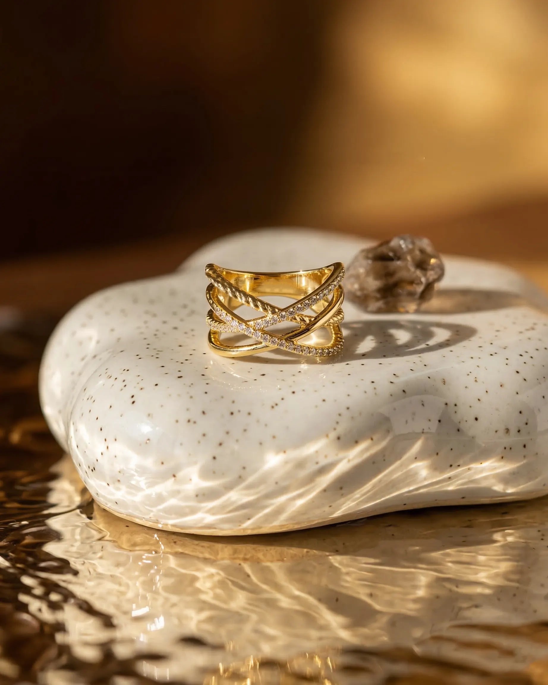 timeless-bold-aesthetic-icon-sparkling-triple-ring, 18k-gold-vermeil-finish-detail-statement-ring, gift-ideas-for-women-elegant-gold-jewelry, luxury-boutique-jewelry-netherlands, artistic-jewelry-flatlay-photography