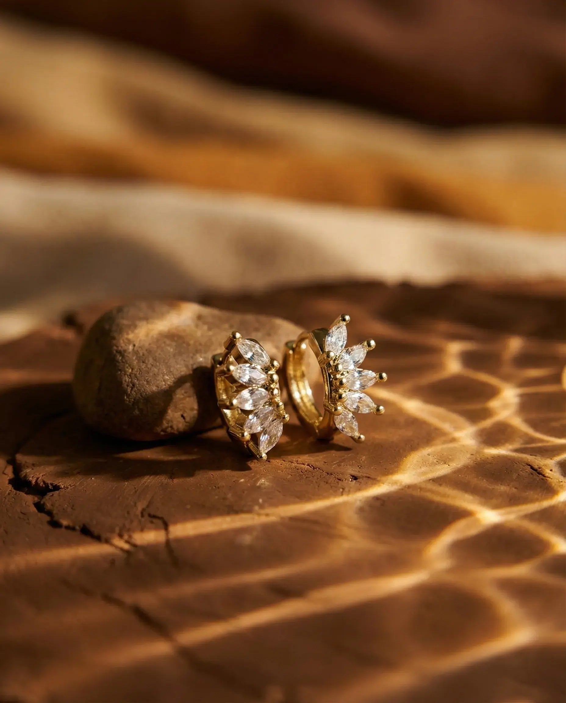 timeless-celestial-star-earrings-modern-aesthetic, 925-sterling-silver-detail-laynie-huggies, gift-ideas-for-women-dazzling-jewelry, luxury-boutique-jewelry-netherlands, artistic-jewelry-flatlay-photography