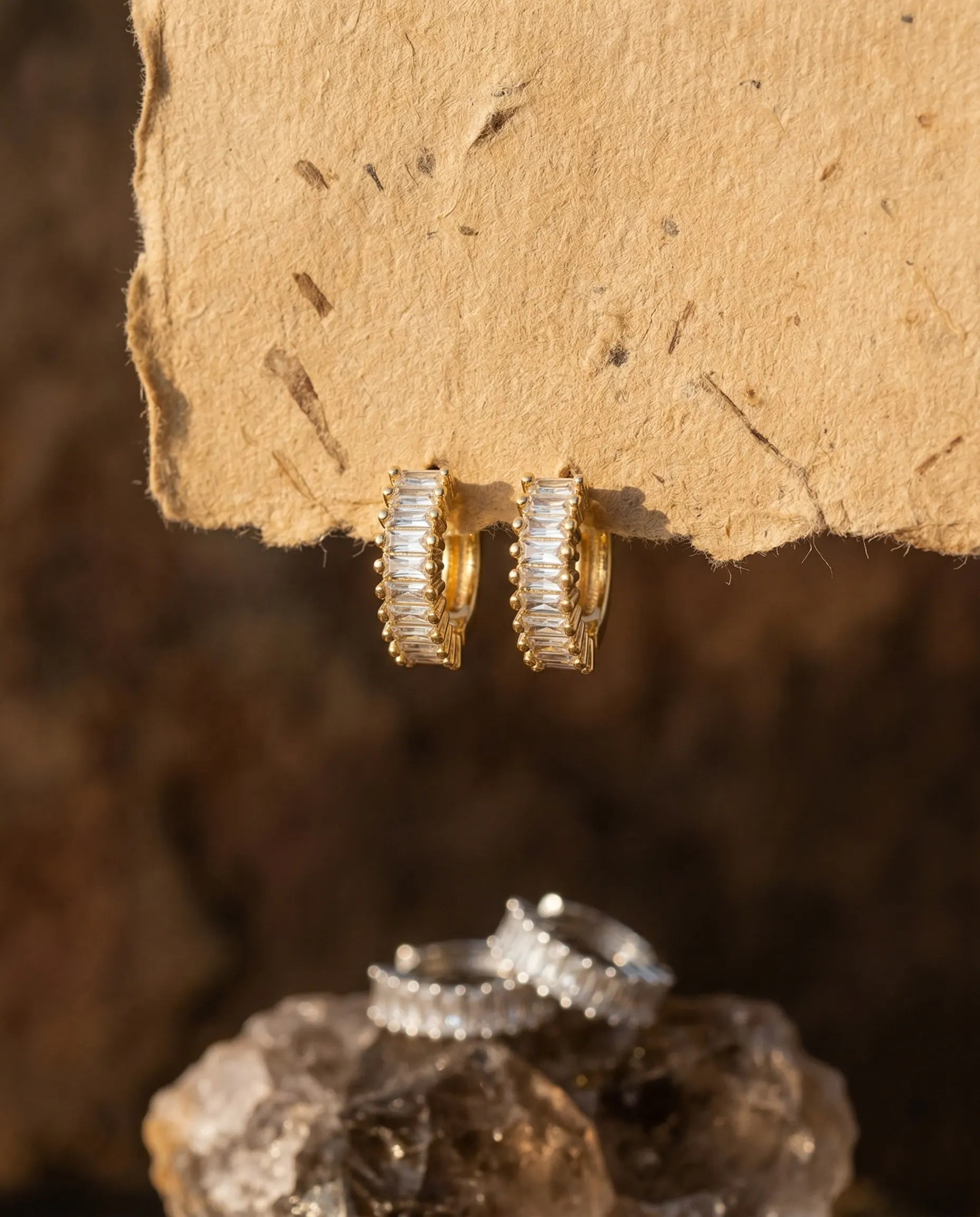 timeless-minimalist-aesthetic-lydia-sparkling-baguette-hoops, 18k-gold-plating-finish-detail-huggie-earrings, gift-ideas-for-women-elegant-gold-jewelry, luxury-boutique-jewelry-netherlands, artistic-jewelry-flatlay-photography
