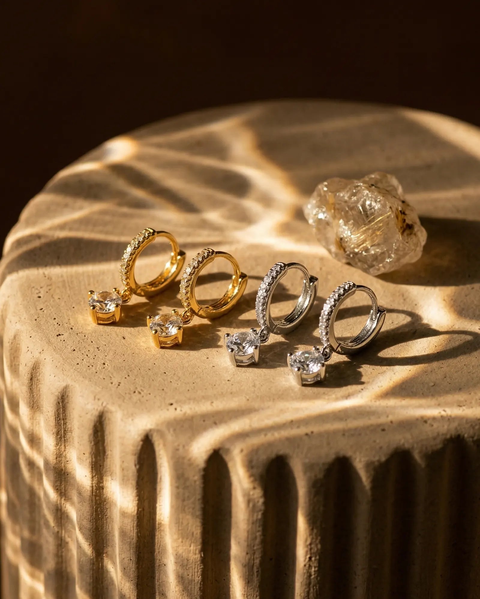 timeless-modern-aesthetic-dafne-sparkling-earrings-gold-silver, 18k-gold-vermeil-finish-detail-drop-huggie, gift-ideas-for-women-personlized-sparkle-jewelry, luxury-boutique-jewelry-netherlands, artistic-jewelry-flatlay-photography