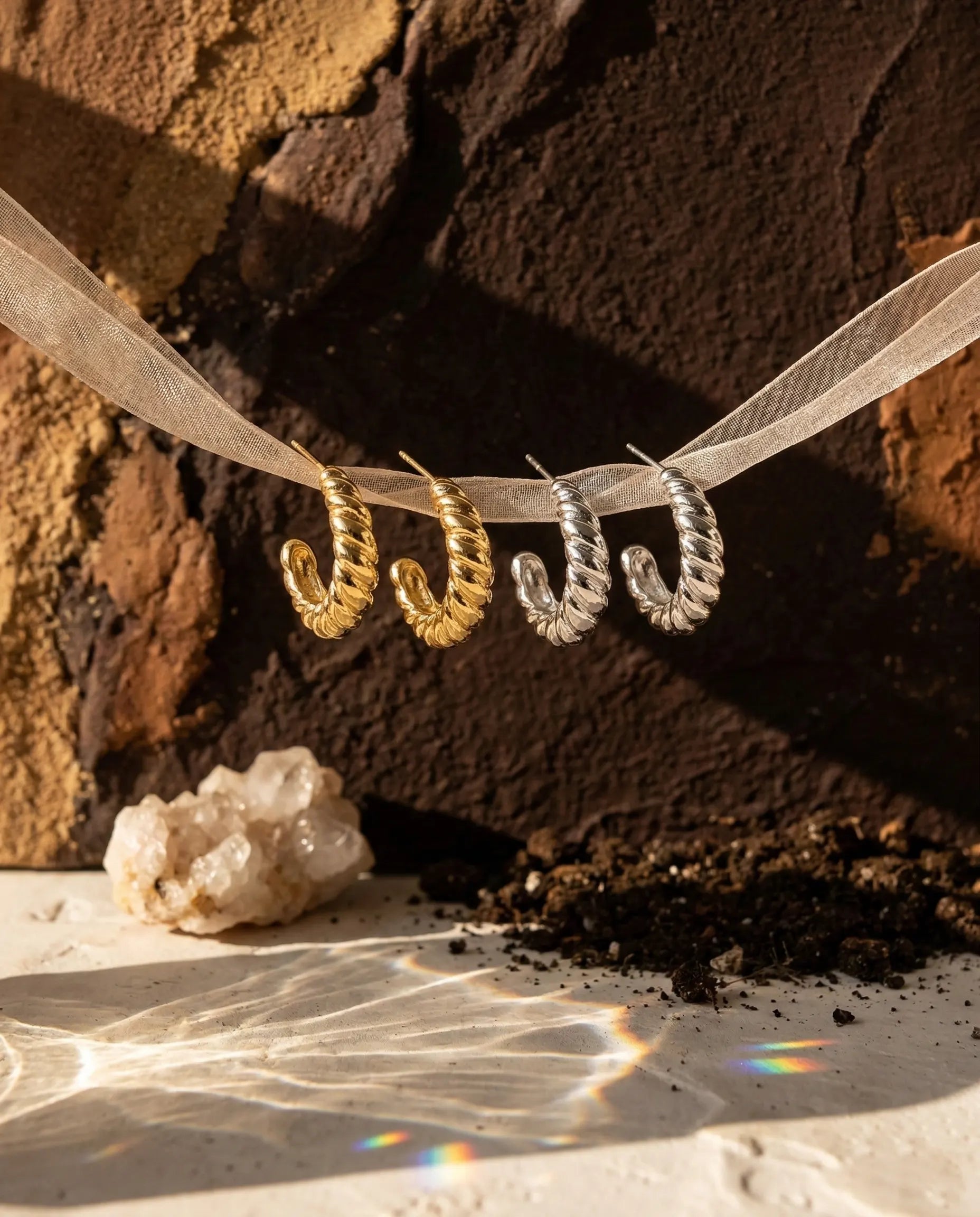 timeless-sparkling-aesthetic-twisted-hoops-modern, 18k-gold-pvd-finish-detail-museful-earrings, gift-ideas-for-women-glamorous-jewelry, luxury-boutique-jewelry-netherlands, artistic-jewelry-flatlay-photography