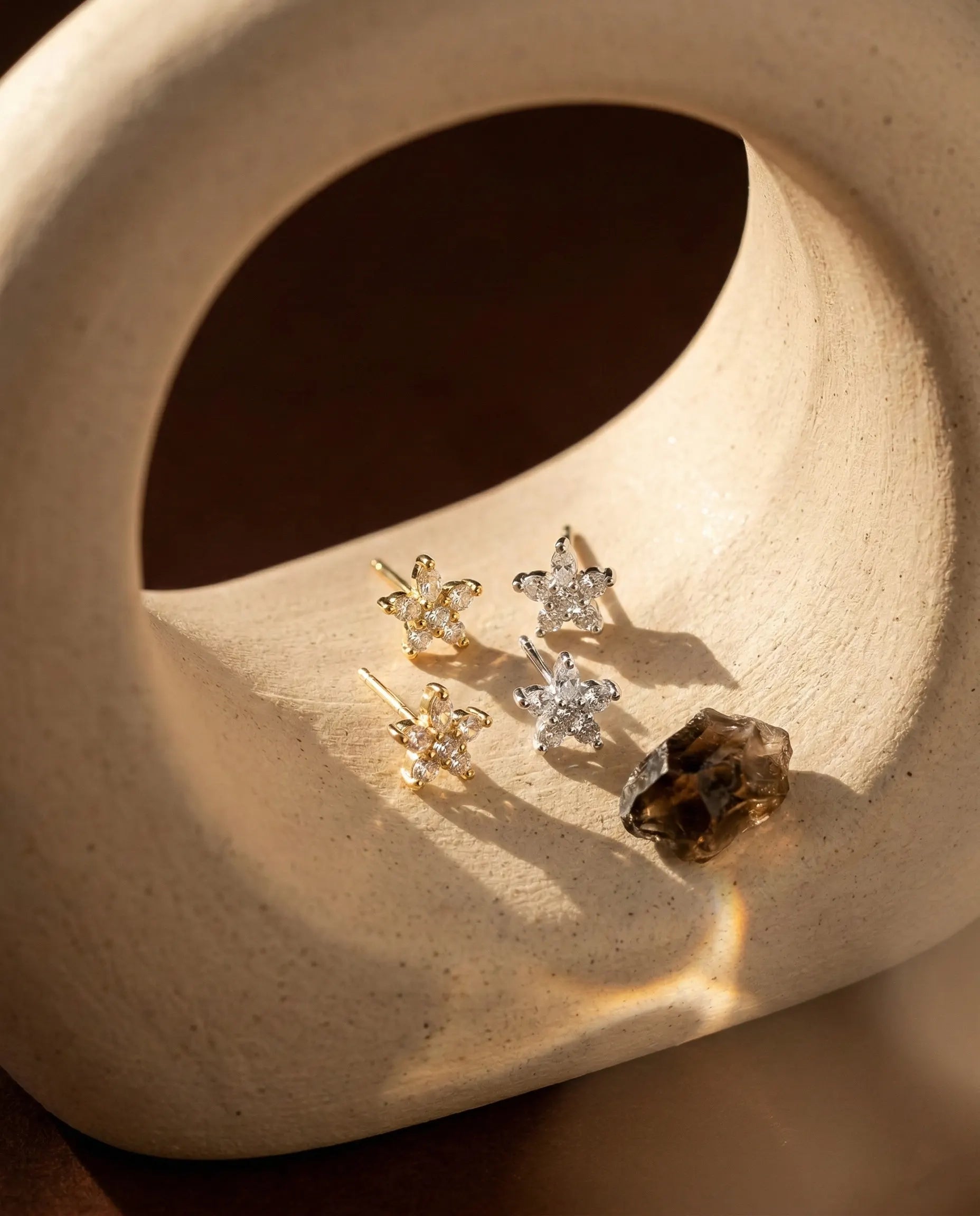 timeless-star-aesthetic-stud-earrings-modern, 18k-gold-finish-detail-alexa-studs, gift-ideas-for-women-celestial-jewelry, luxury-boutique-jewelry-netherlands, artistic-jewelry-flatlay-photography