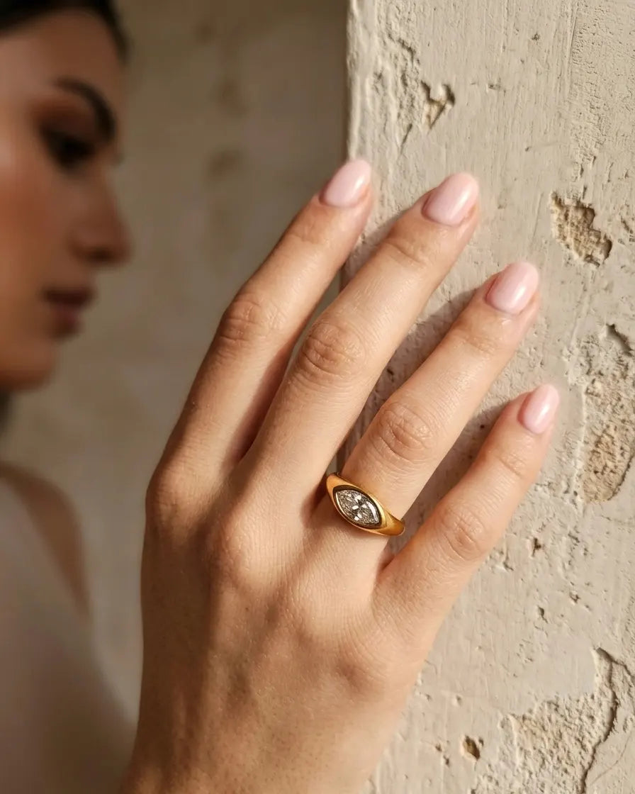 versatile-daily-wear-gold-selah-statement-ring, effortless-strength-jewelry-style, minimalist-accessories-for-refined-look, classy-gold-pvd-marquise-ring-lifestyle, senya-jewelry-selah-collection