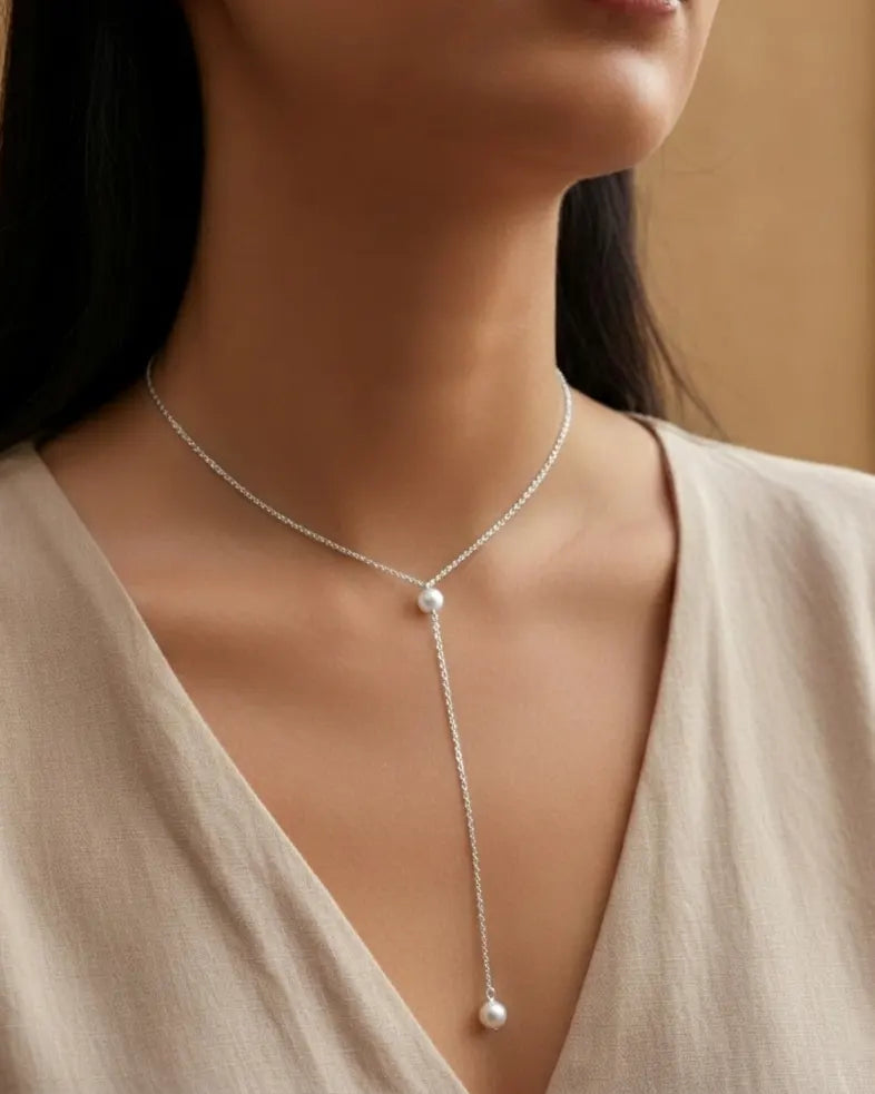 versatile-daily-wear-pearl-lariat-necklace, effortless-elegance-jewelry-style, minimalist-accessories-for-deep-necklines, classy-gold-pvd-necklace-lifestyle, high-shine-316L-stainless-steel-jewelry, senya-jewelry-pacifica-collection