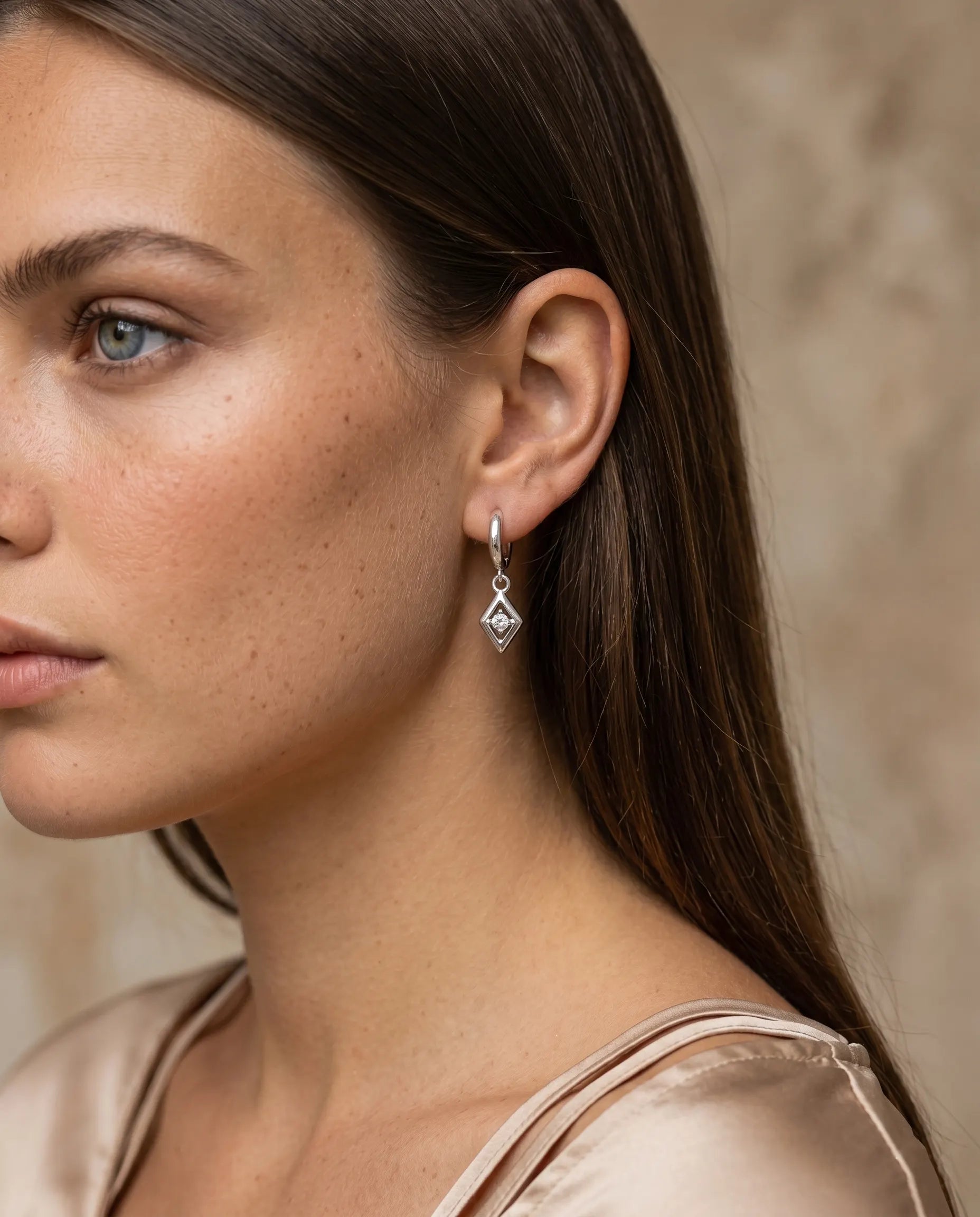 versatile-daily-wear-silver-charm-statement-earrings, effortless-high-end-crystal-drop-style, minimalist-accessories-for-refined-look, classy-925-silver-solitaire-earrings-lifestyle, senya-jewelry-charm-collection