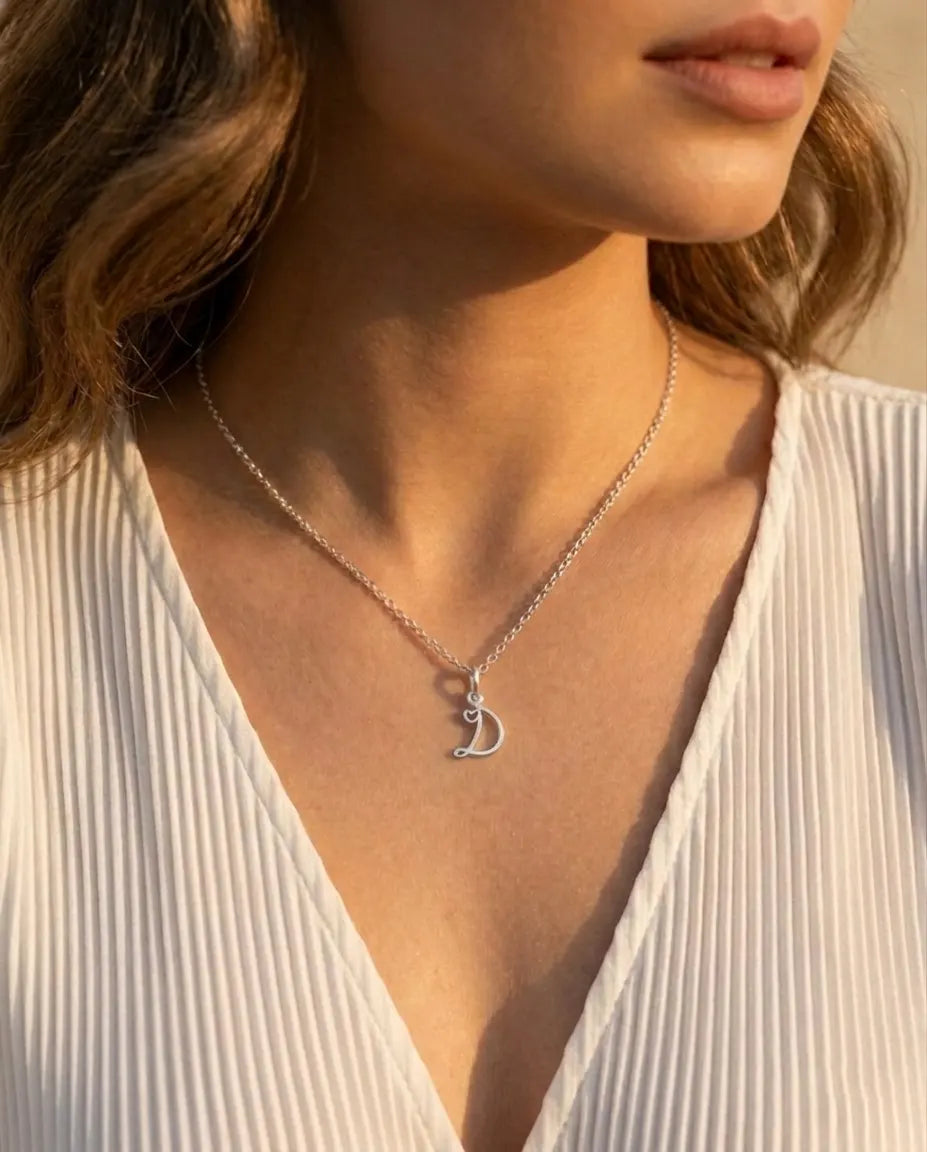 versatile-daily-wear-silver-initial-necklace, effortless-elegance-layering-jewelry-style, minimalist-accessories-for-everyday-wear, classy-silver-monogram-necklace-lifestyle, senya-jewelry-zahara-collection