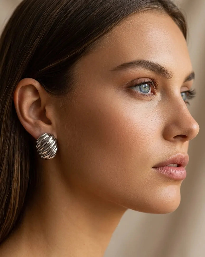 versatile-daily-wear-silver-nia-statement-earrings, effortless-high-end-sculptural-silver-style, minimalist-accessories-for-refined-look, classy-stainless-steel-ribbed-earrings-lifestyle, senya-jewelry-nia-collection