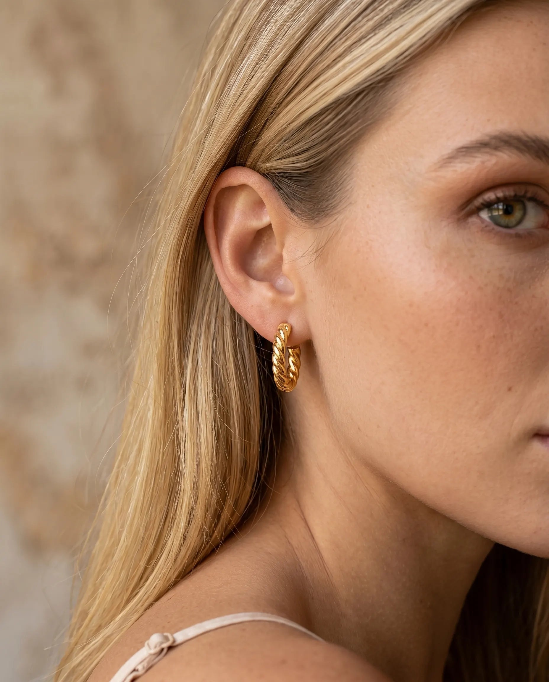 versatile-daily-wear-twisted-silver-huggies, effortless-elegance-jewelry-style, minimalist-accessories-for-office-wear, classy-925-silver-earrings-lifestyle, high-shine-twisted-rope-jewelry, senya-jewelry-swirelle-collection