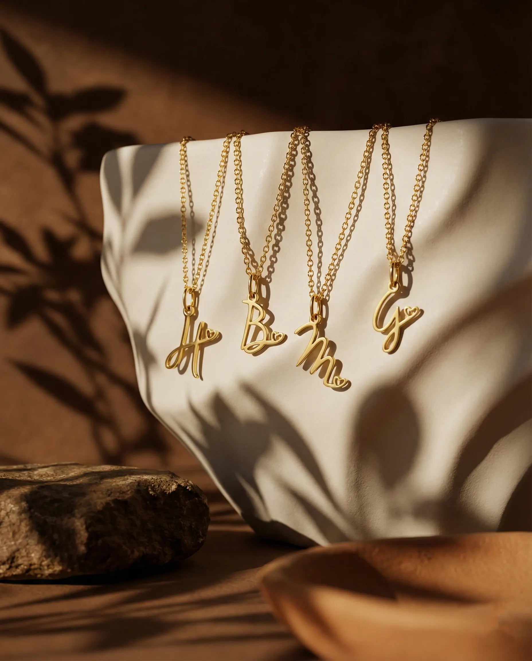 zahara-initial-necklace-alphabet-font-guide, personalized-letter-pendant-selection-gold, unique-script-font-monogram-options, jewelry-gift-customization-europe, modern-calligraphy-initial-jewelry